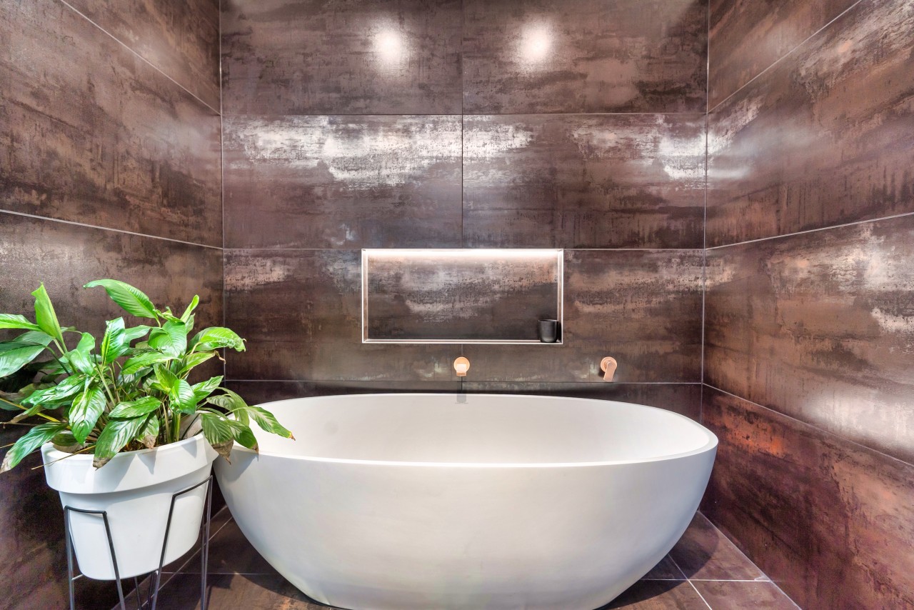 The bath inhabits its own dedicated space. - 