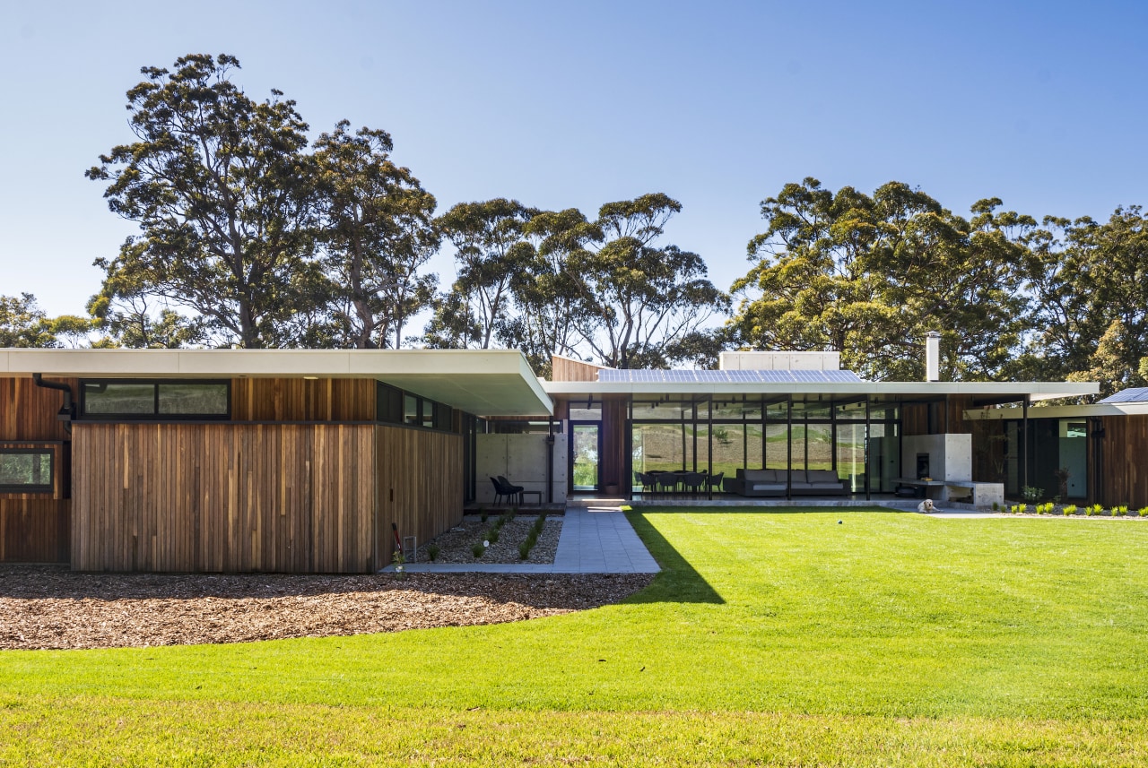 The central living zone is transparent with operable 