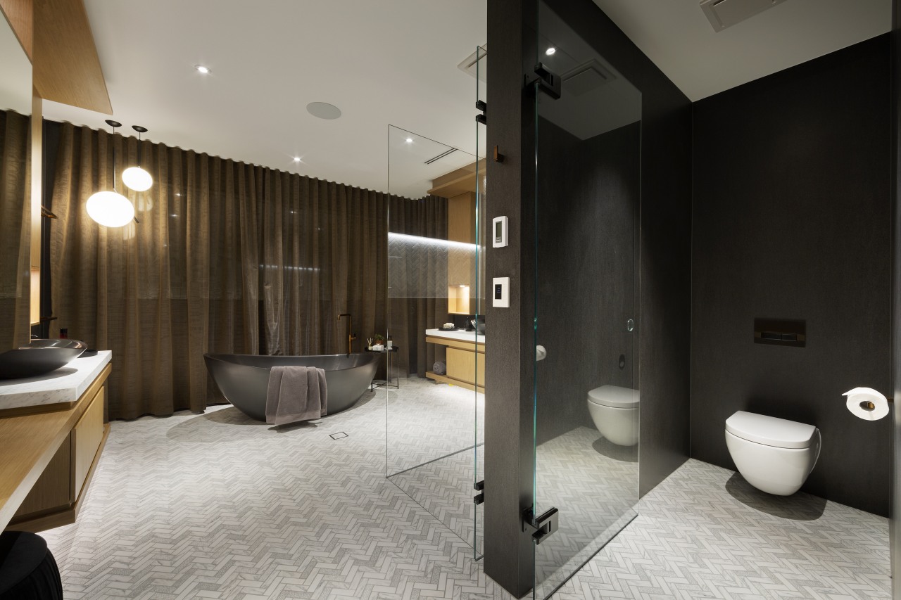 A private toilet space sits alongside the shower 