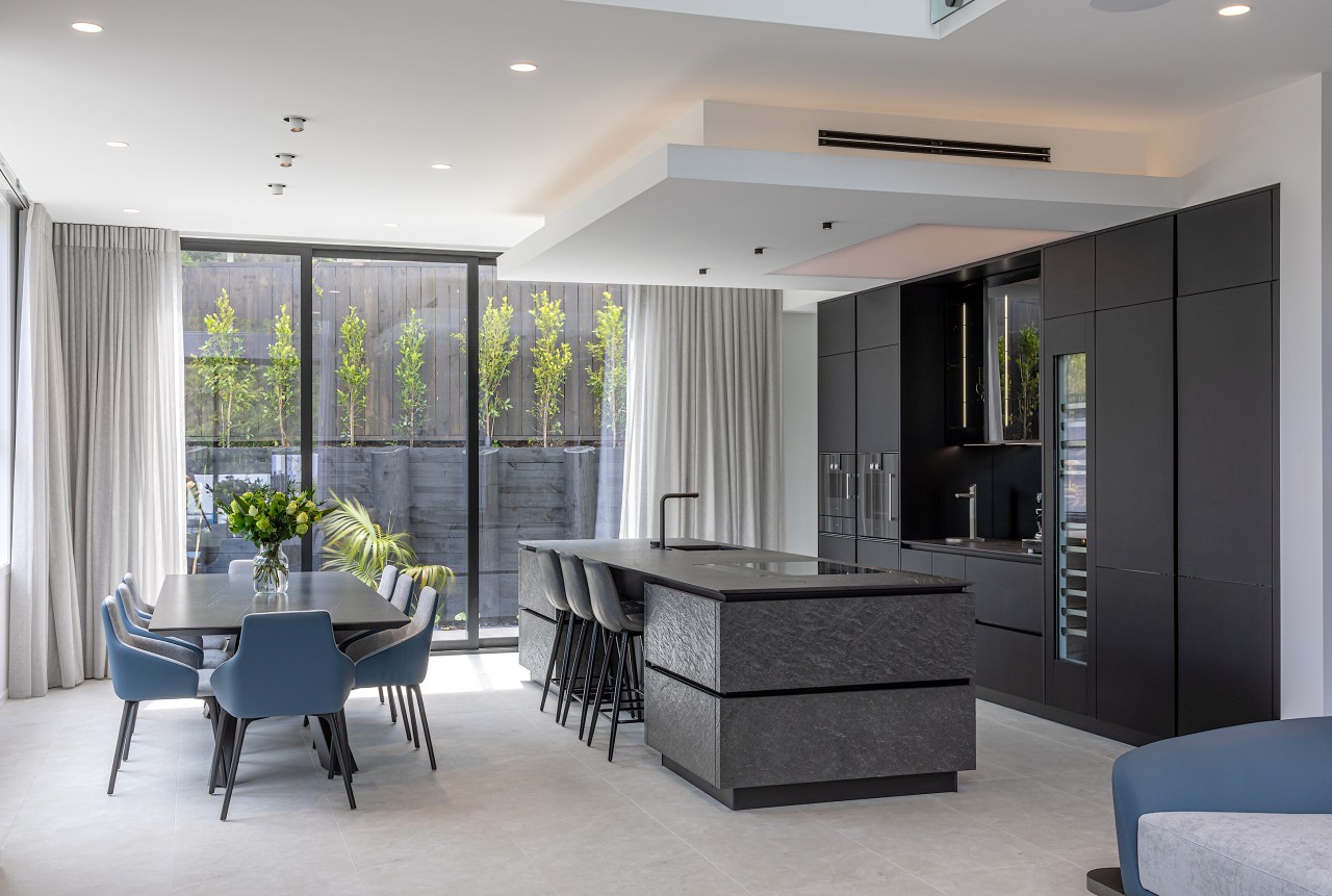 The modern island has a furniture-like quality, helping 