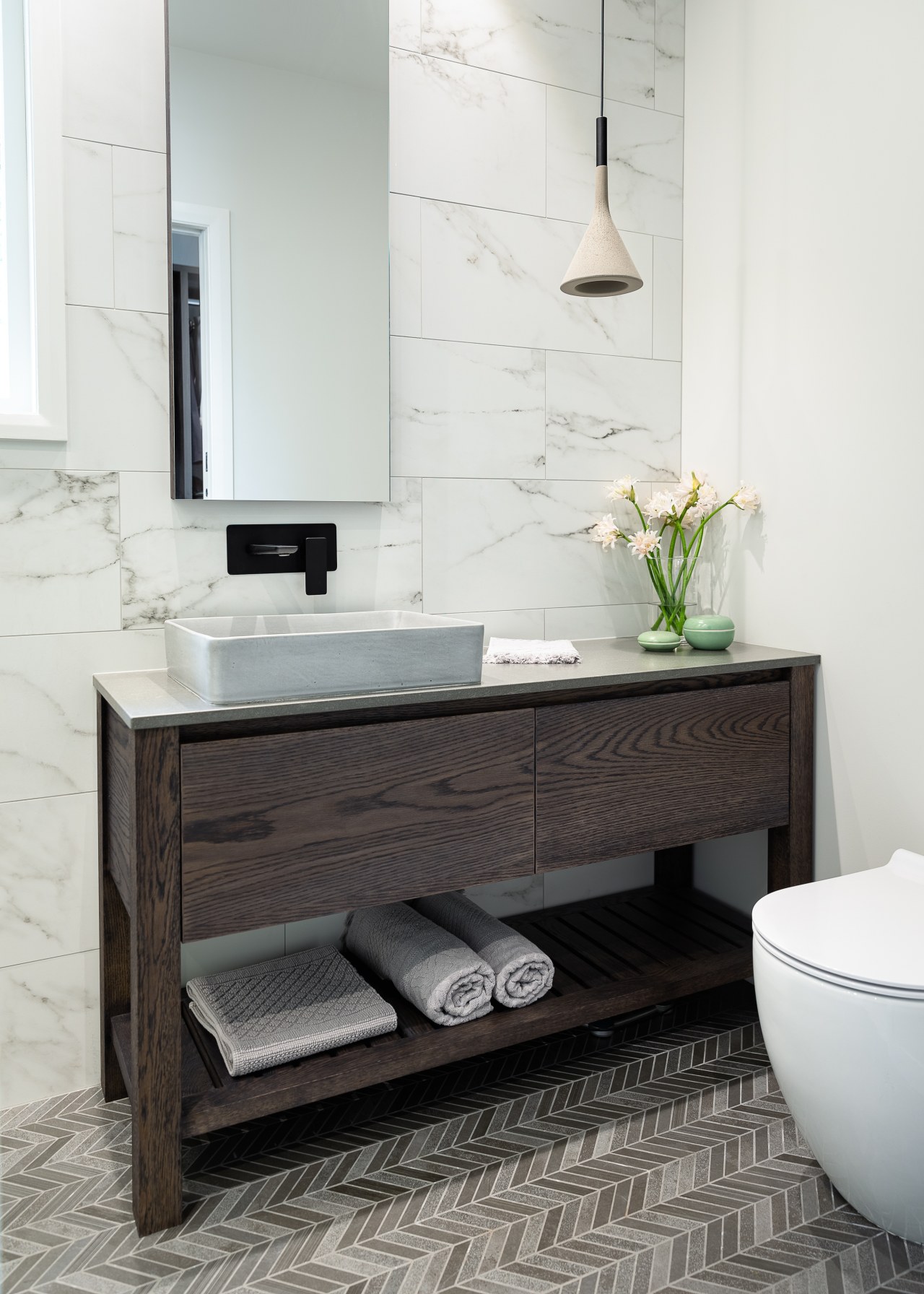 The large, custom-designed vanity includes wide drawers for 