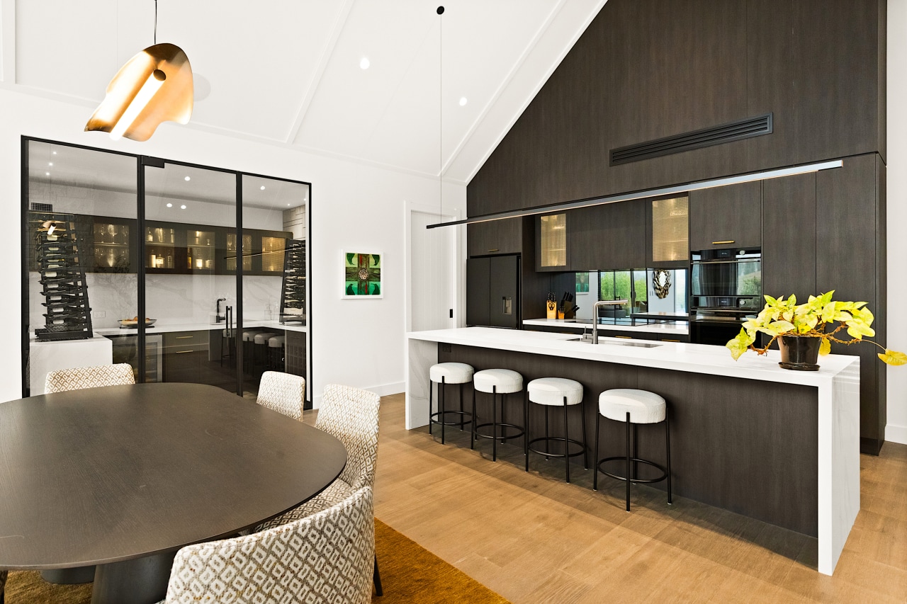 The use of natural materials, soaring cabinetry, and 