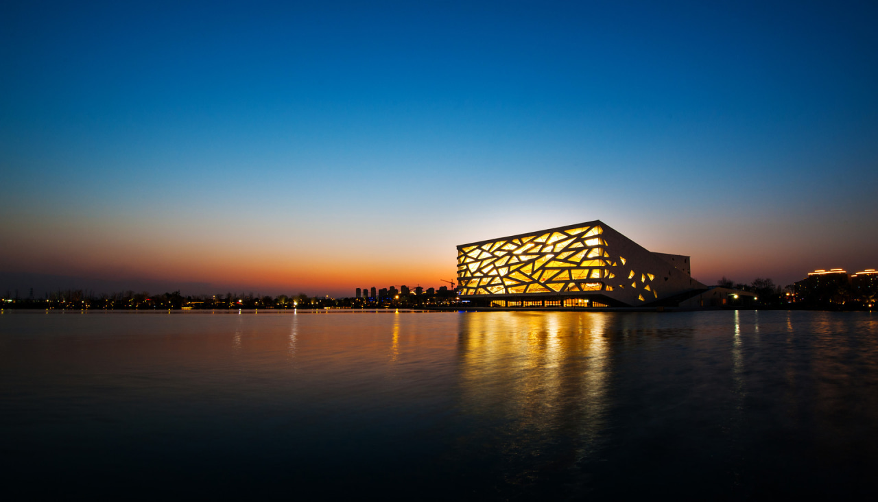 Reminiscent of The Bird's Nest made with straight afterglow, architecture, calm, daytime, dusk, evening, horizon, morning, reflection, sky, sunrise, sunset, water, black