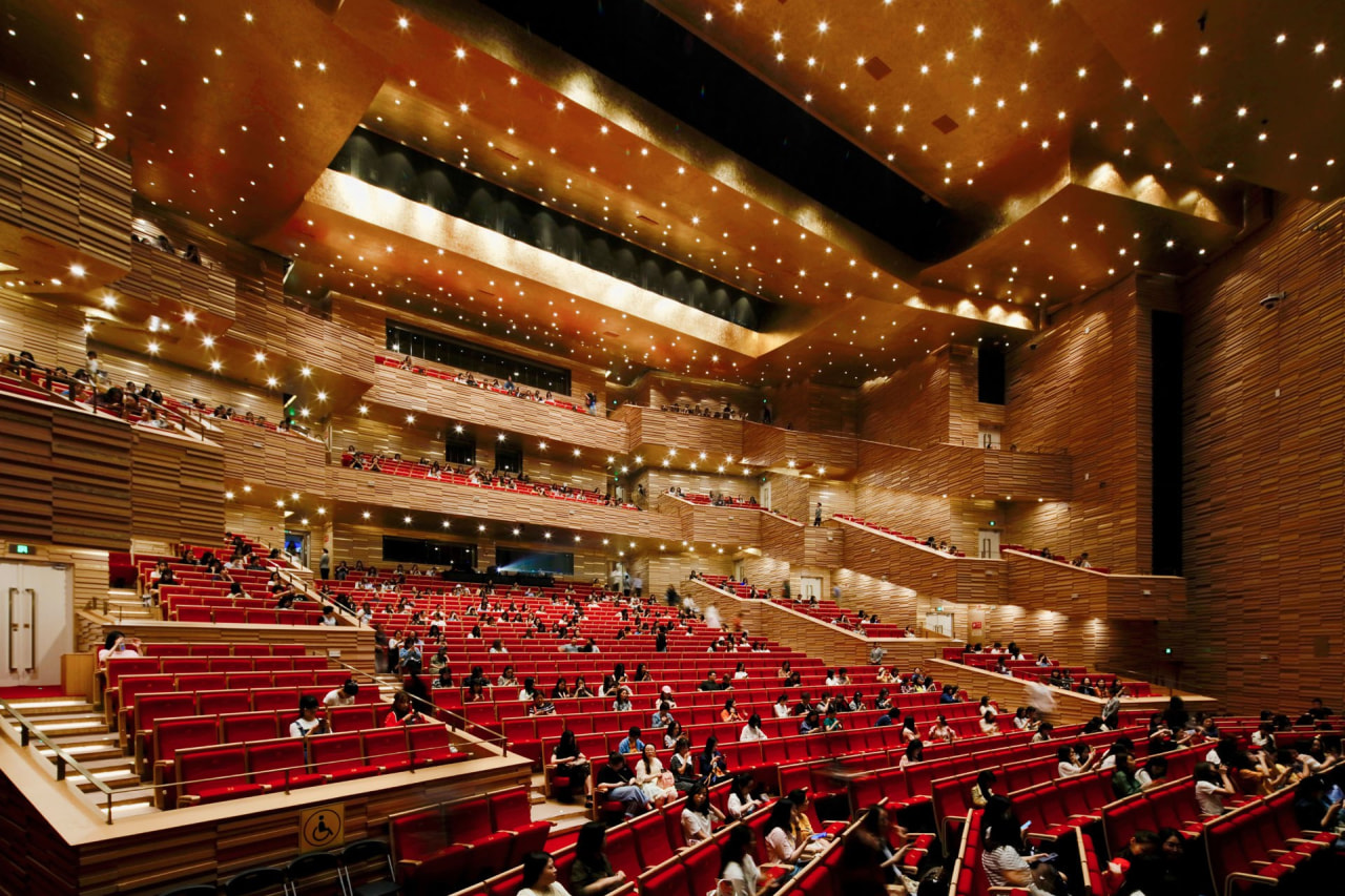 The Opera building comprises two main performance/event spaces: architecture, auditorium, building, concert hall, convention center, heater, musical instrument accessory, opera house, orchestra pit, performing arts center, stage, theatre, brown, red