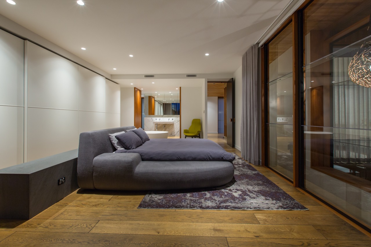 Teak slats flank the open entry to this architecture, bed frame, bedroom, ceiling, floor, interior design, real estate, room, wall, wood, wood flooring, gray, brown