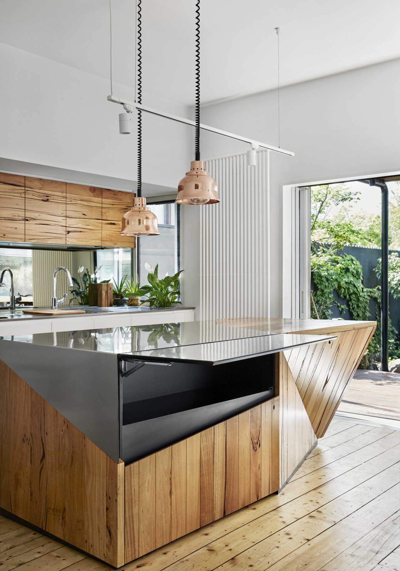 The stainless steel front panel on this kitchen countertop, house, interior design, kitchen, wood, white, storage, innovative storage