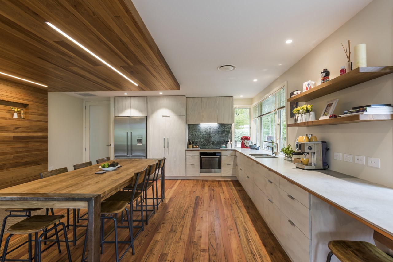 Renovation creates large open-plan living space and opens cabinetry, countertop, bencthop, Resene, floor, flooring, hardwood, interior design, kitchen, wood, wood flooring, Higham Architecture, plywood