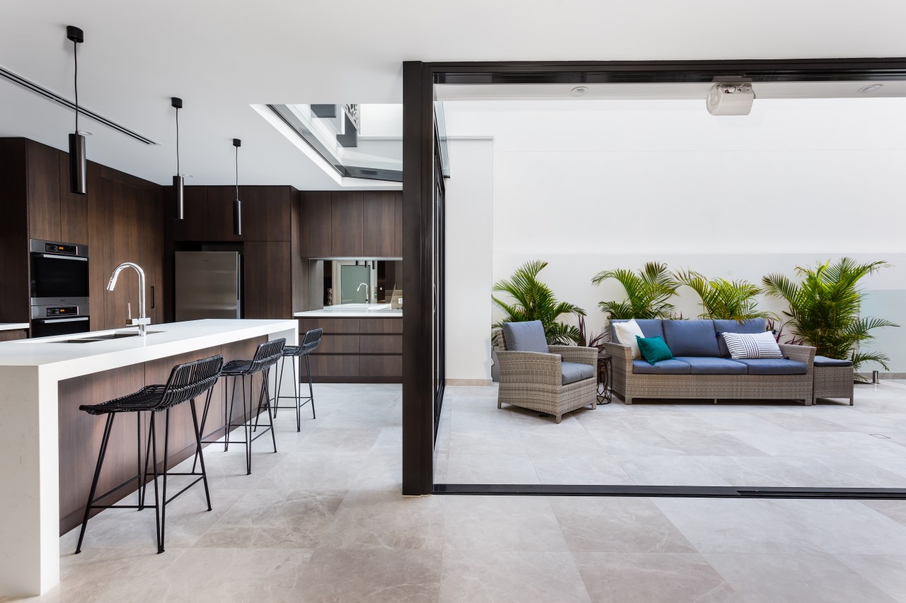 This clean-lined kitchen forms part of a whole-house floor, interior design, living room, white, gray