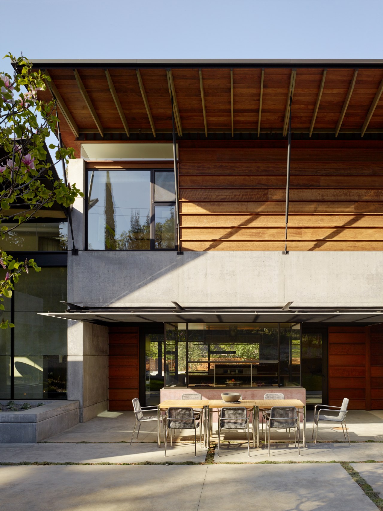 Reclaimed redwood cladding contrasts with the predominantly concrete architecture, house, home, roof, siding, cladding, concrete, redwood, FuTung Cheng, Cheng Design