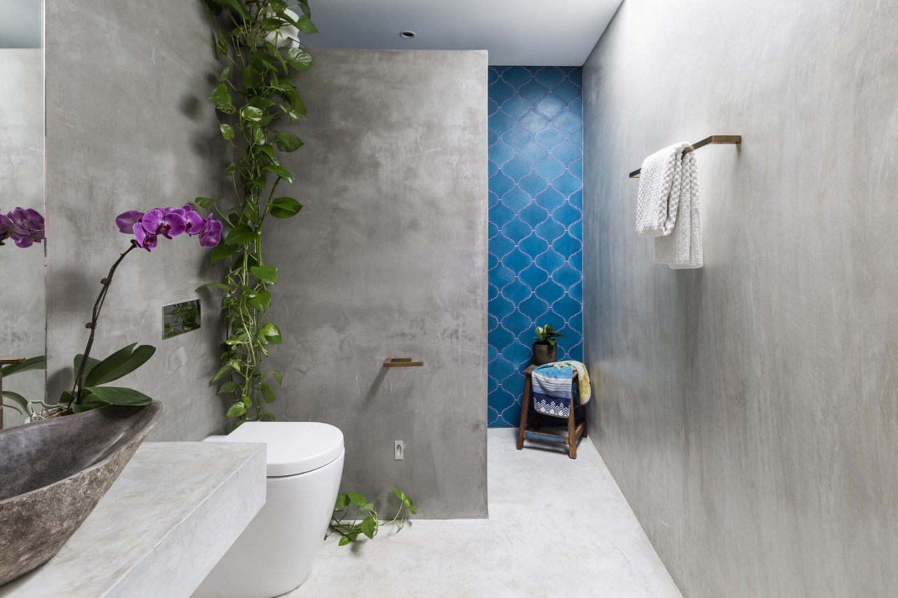 ​​​​​​​Vivid blue encaustic tiles add a splash of architecture, bathroom, interior design, gray, blue, tiles, grey, concrete vanity top