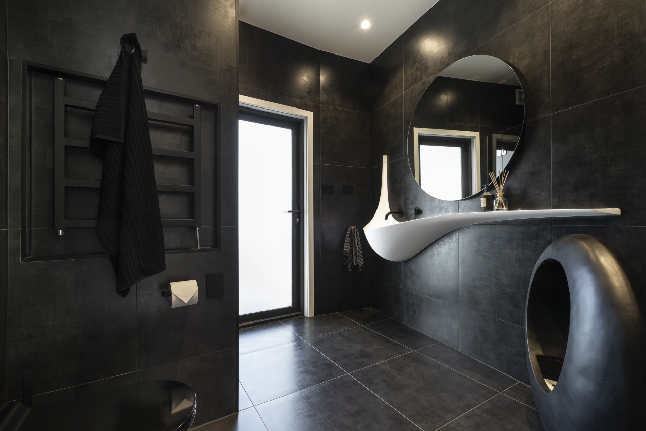 ​​​​​​​For this bathroom by designer Celia Visser, the architecture, bathroom, floor, flooring, tiles, home, house, plumbing fixtures, black, Vanity