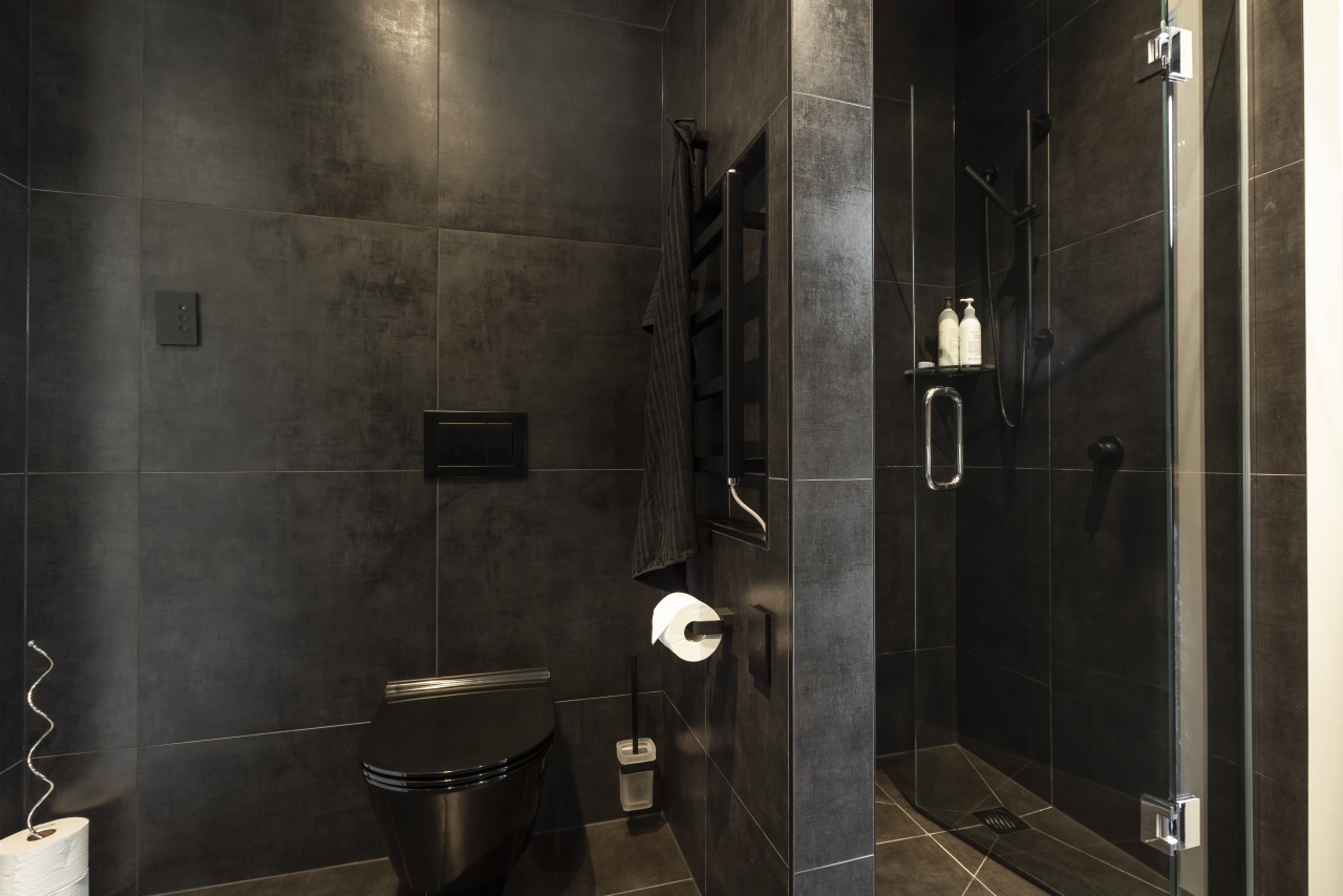 ​​​​​​​Given the through nature of this bathroom, it architecture, bathroom, floor, flooring, tiles, plumbing fixture, shower, black, Celia Visser Design