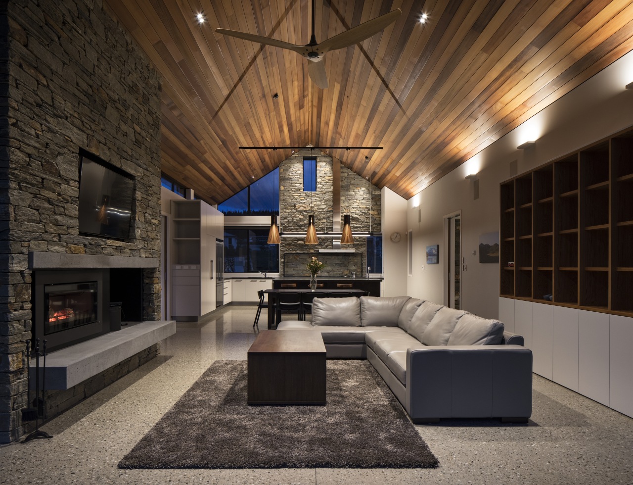 ​​​​​​​Polished concrete floors run through this home. Besides architecture, building, design, floor, flooring, furniture, home, house, interior design, lighting, living room, timber ceiling, fireplace, Condon Scott Architects