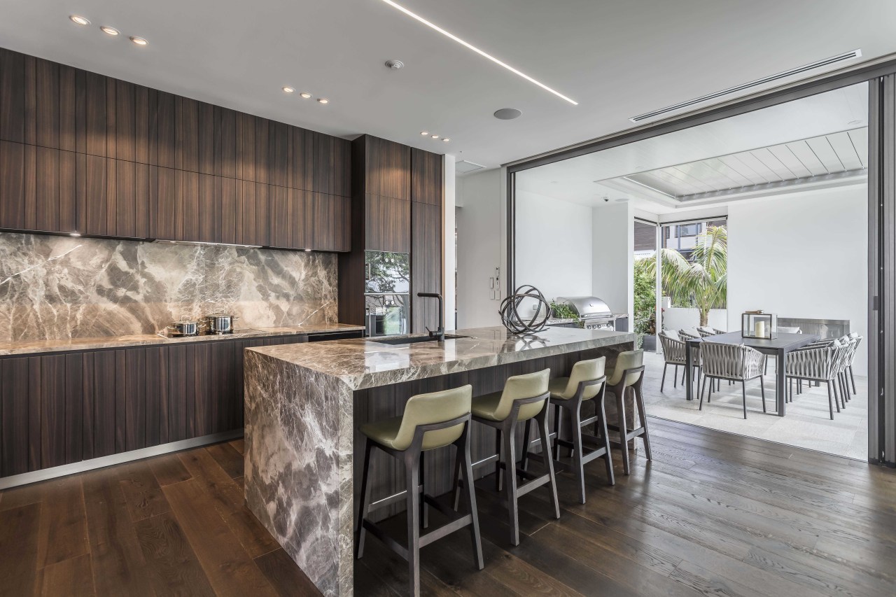 ​​​​​​​While the LED strip ceiling lighting is understated architecture, cabinetry, countertop, benthtop, design, dining room, floor, flooring, furniture, hardwood, home, house, interior design, kitchen, dining table, wood flooring, marble, Studio Italia