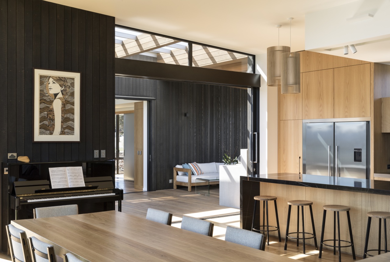 ​​​​​​​The play of wood and black is seen architecture, building, design, dining room, floor, flooring, furniture, hardwood, home, house, interior design, living room, loft, table, wood flooring, black, Eliska Lewis Architects