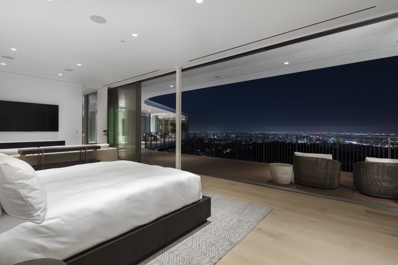 ​​​​​​​At night, large sliding glass panels open this home, house, architecture, bedroom, black-and-white, design, floor, flooring, furniture, home, house, interior design, lighting, open living, sliding glass panels, city views, spfa