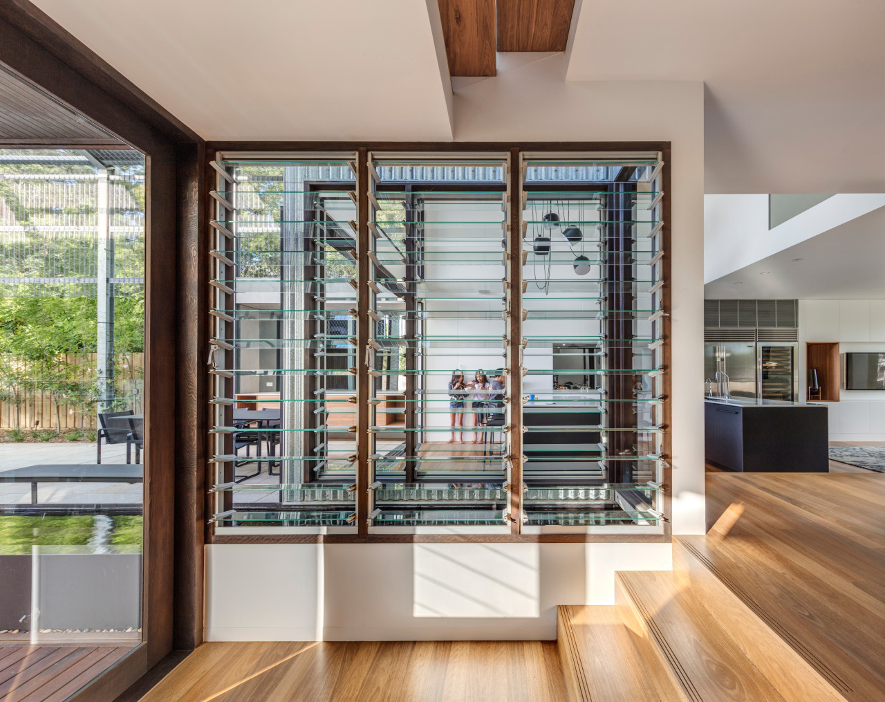 A pond – seen through the windows in architecture, flooring, furniture, glass, hardwood, home, house, interior design, laminate flooring, living room, windows, wood, wood flooring, CplusC Architectural Workshop