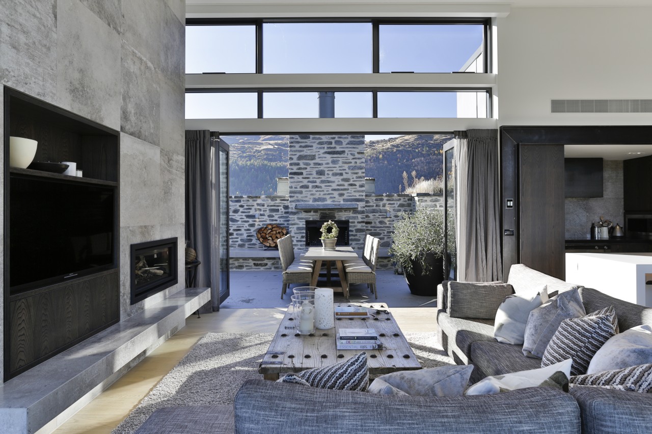 ​​​​​​​On this Arrowtown home, substantial bifold doors let home, architecture, design, floor, furniture, home, house, interior design, living room, table, wall, Koia Architects, Bifold doors