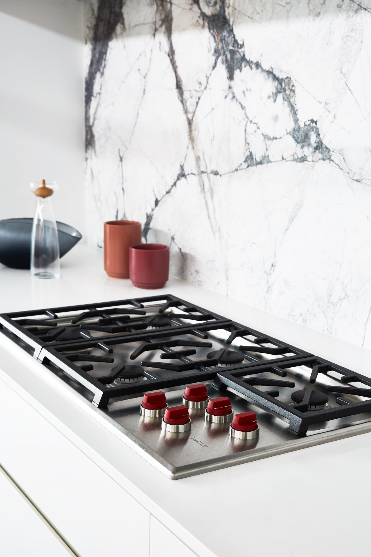 Appliances that are on display in this kitchen cooktop, countertop, furniture, gas, gas stove, interior design, kitchen, material property, room, table, tile, white
