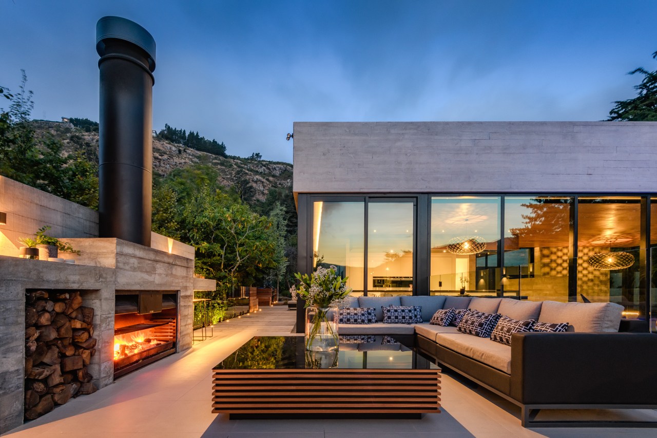 The board-formed concrete on this award-winning home extends architecture, backyard, building, design, estate, facade, home, house, interior design, landscape, landscaping, living room, mansion, mixed-use, patio, property, real estate, residential area, roof, room, sky