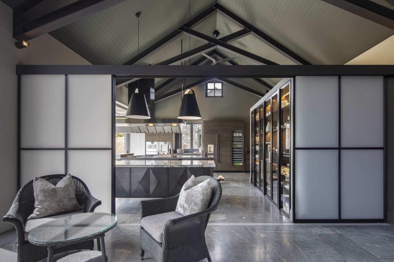 ​​​​​​​Japanese-look screens part to reveal this industrial-look kitchen gray, black