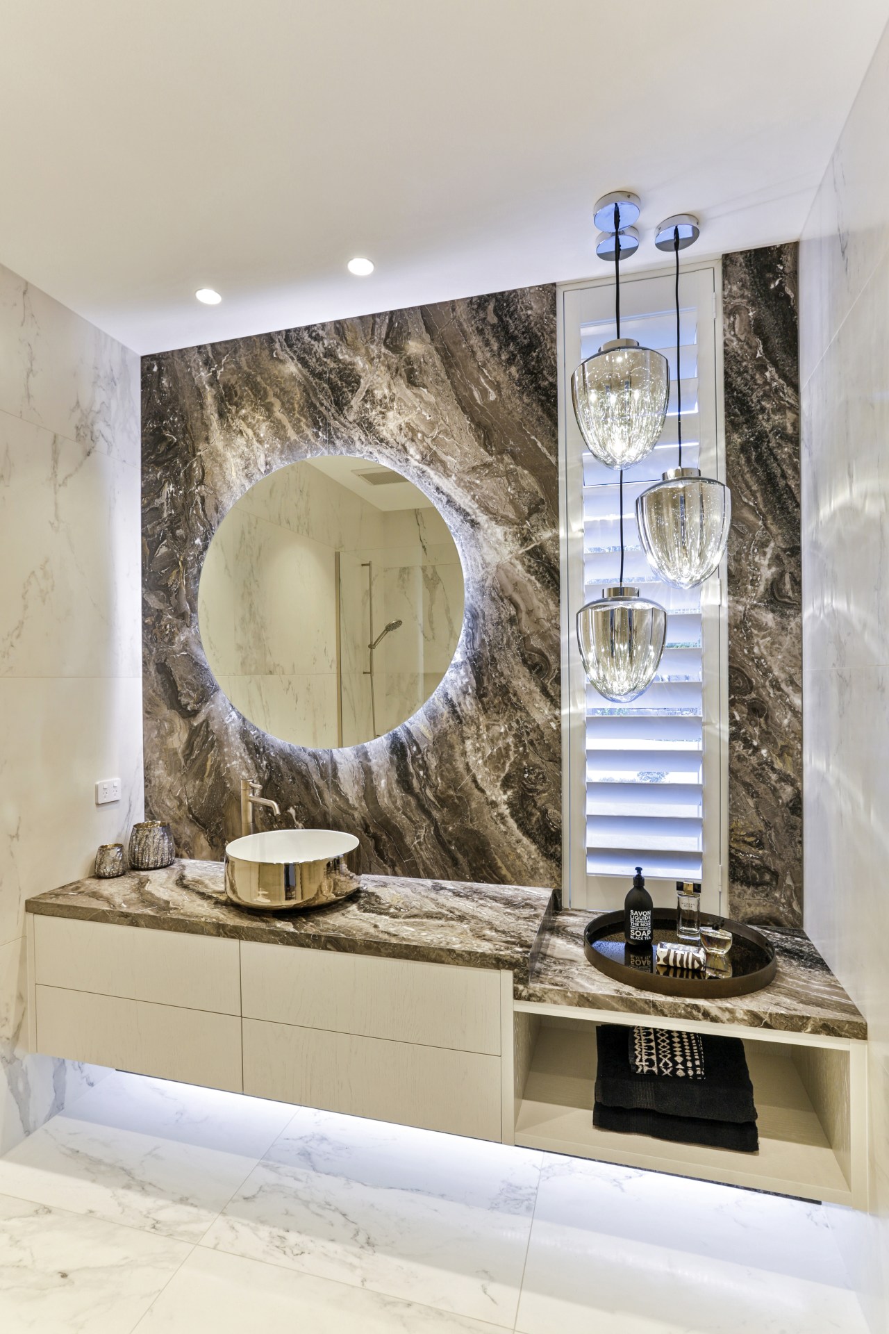 ​​​​​​​In this powder room, by Dunlop Design, the gray