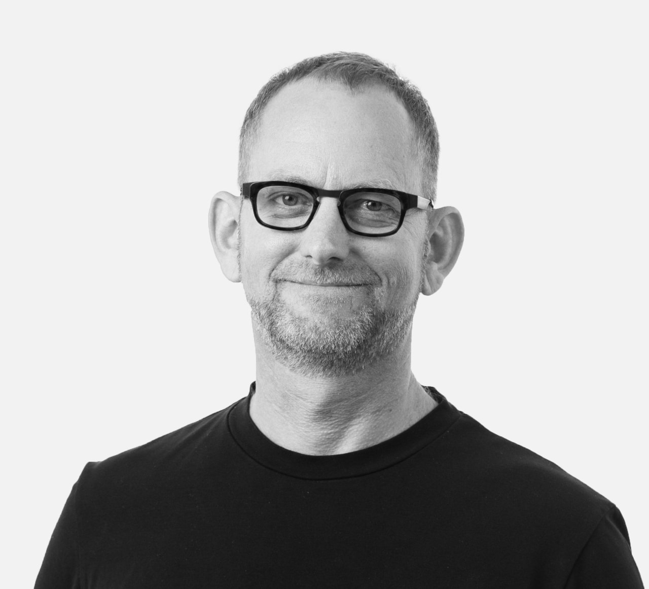 Chris Paterson, senior principal at Populous beard, black, black-and-white, cool, eyewear, facial hair, gentleman, glasses, male, monochrome, monochrome photography, neck, photograph, photography, portrait, sleeve, standing, stock photography, t-shirt, vision care, white, white, black