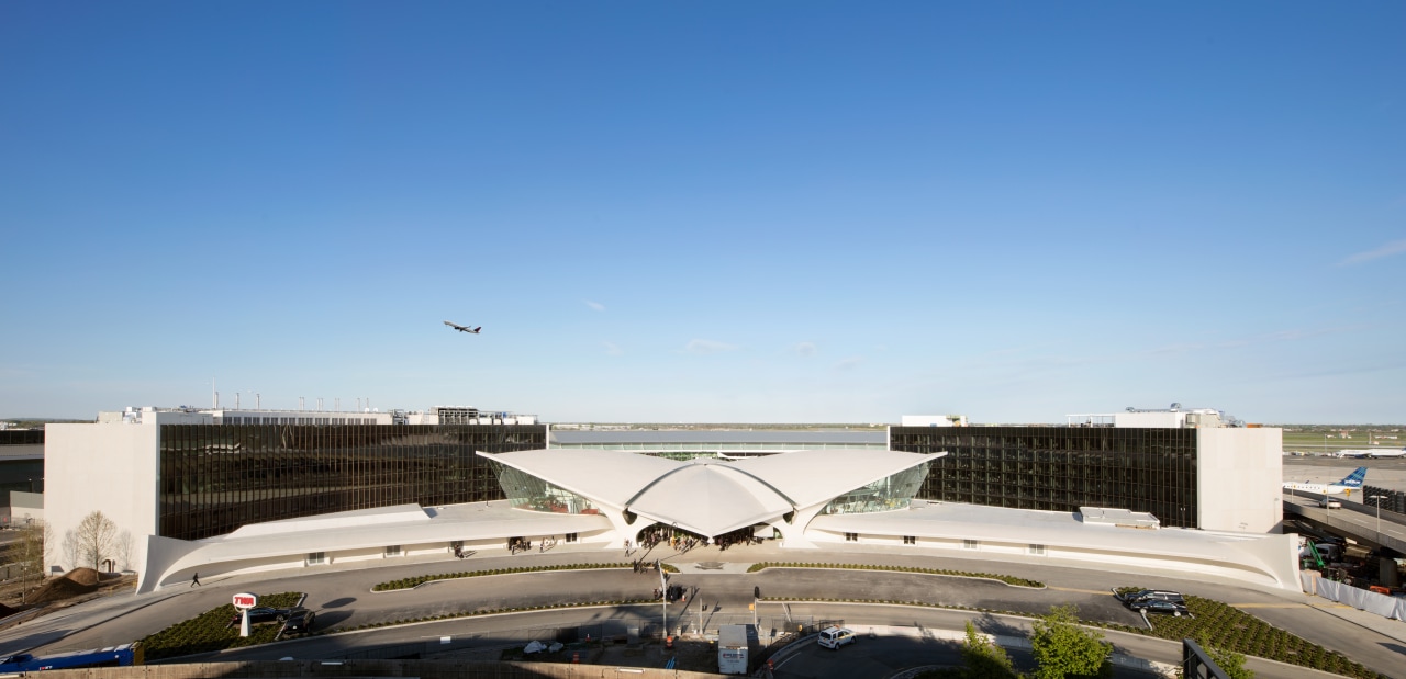 Two brand new wings behind Eero Saarinen’s historic aerospace engineering, air travel, aircraft, airline, airliner, airplane, airport, airport apron, TWA Hotel