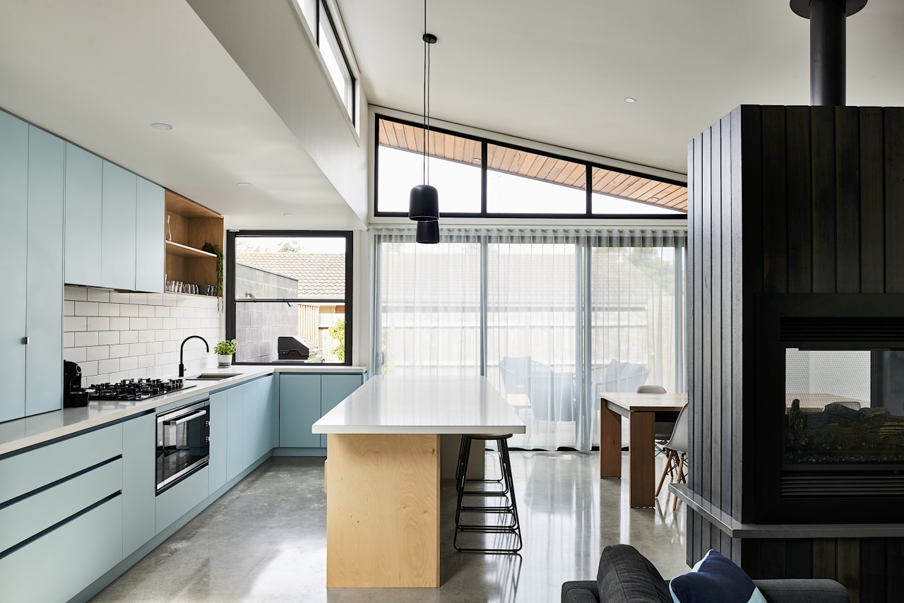 A skillion roof allows for clerestory windows and gray, white