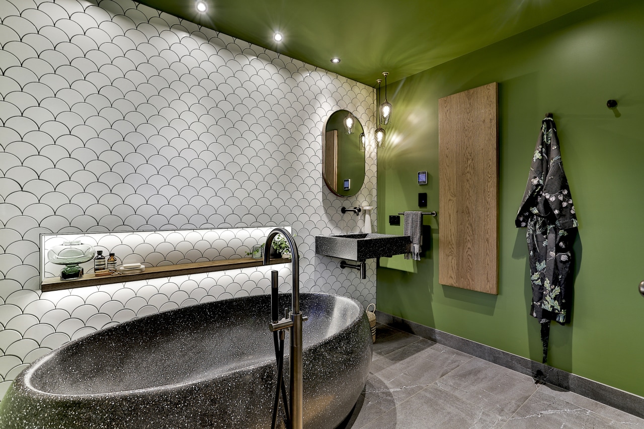 The original theme for this bathroom was going architecture, bathroom, building, ceiling, floor, flooring, green, house, interior design, plumbing fixture, property, room, space, tile, wall, gray, brown