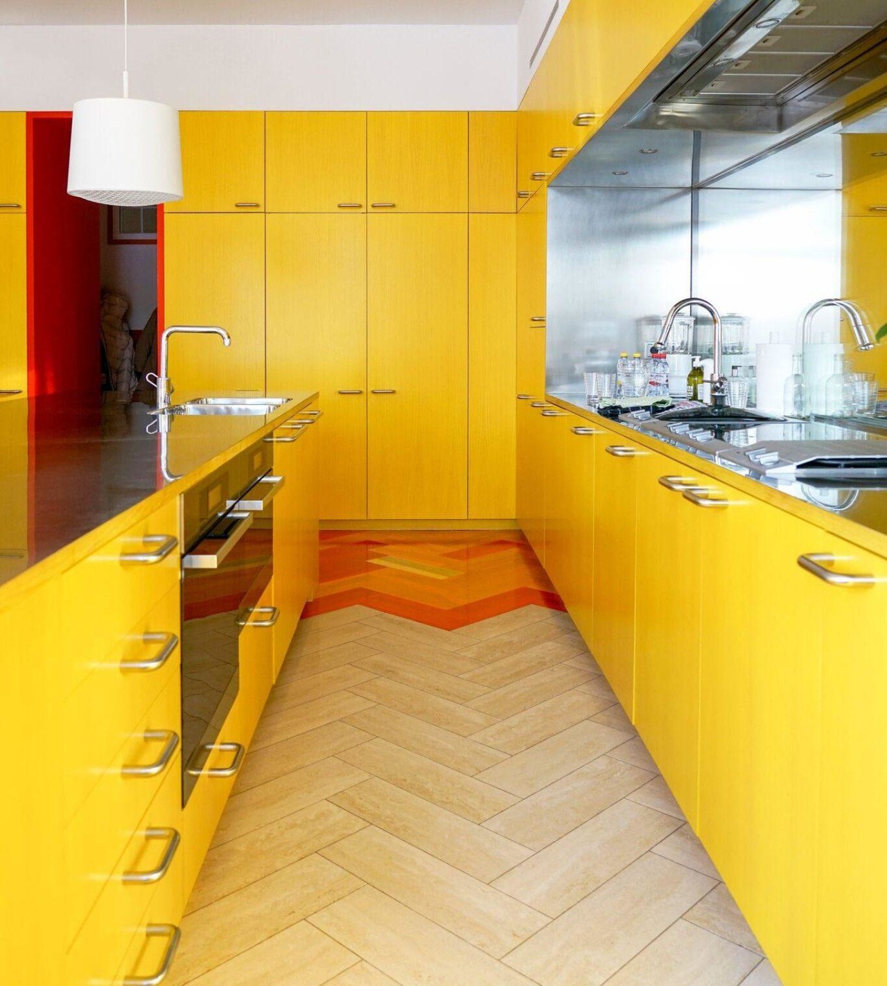 All the colours in the flat come from architecture, building, cabinetry, ceiling, countertop, floor, flooring, furniture, house, interior design, kitchen, material property, orange, property, room, tile, yellow, orange