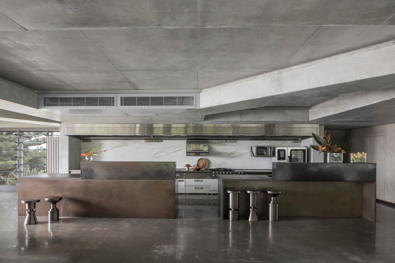 Concrete floor, concrete ceiling, and commercial-look kitchen in 