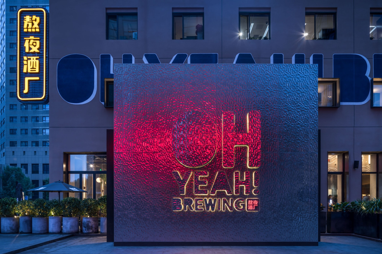 On the exterior, the large font lettering of “Oh advertising, architecture, blue, building, electronic signage, facade, font, light, lighting, neon, night, real estate, signage, technology, blue