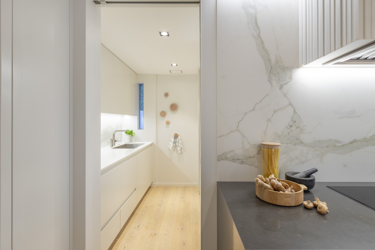 An adjoining bathroom behind the kitchen was reconfigured architecture, beige, building, ceiling, design, floor, flooring, furniture, home, house, interior design, loft, material property, property, real estate, room, tile, wall, gray