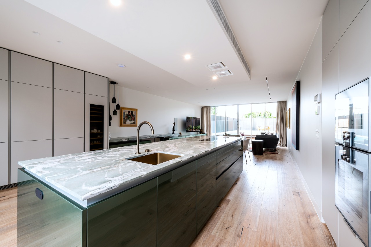 Poggenpohl cabinetry in Pine Green metallic gloss lacquer 