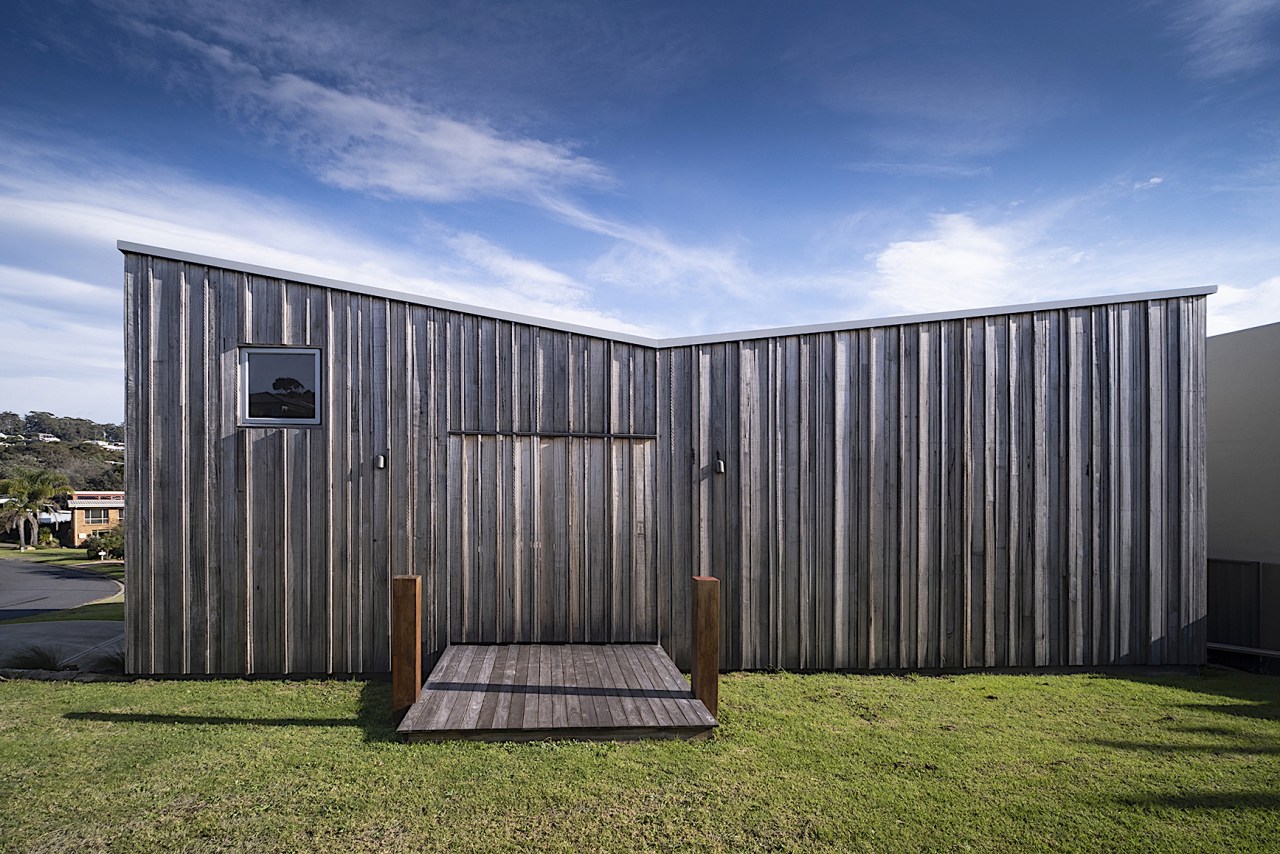 The upstairs entry disappears into the woodwork – 