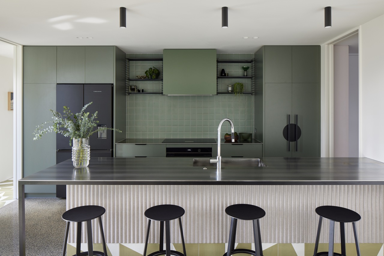 Green is the block colour in the kitchen. 