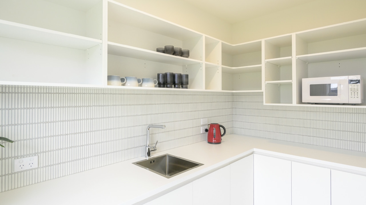 The white, bright and spacious walk-in scullery. 