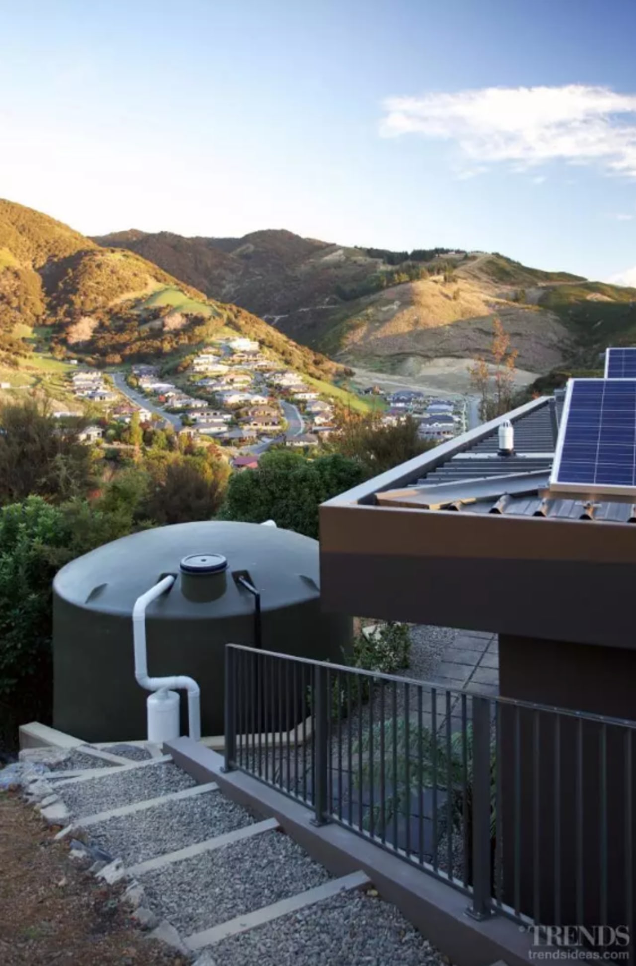 A grey-water sump recycles water from the showers, architecture, building, daylighting, handrail, home, house, mountain, mountain range, property, real estate, residential area, roof, room, sky, slope, black, white