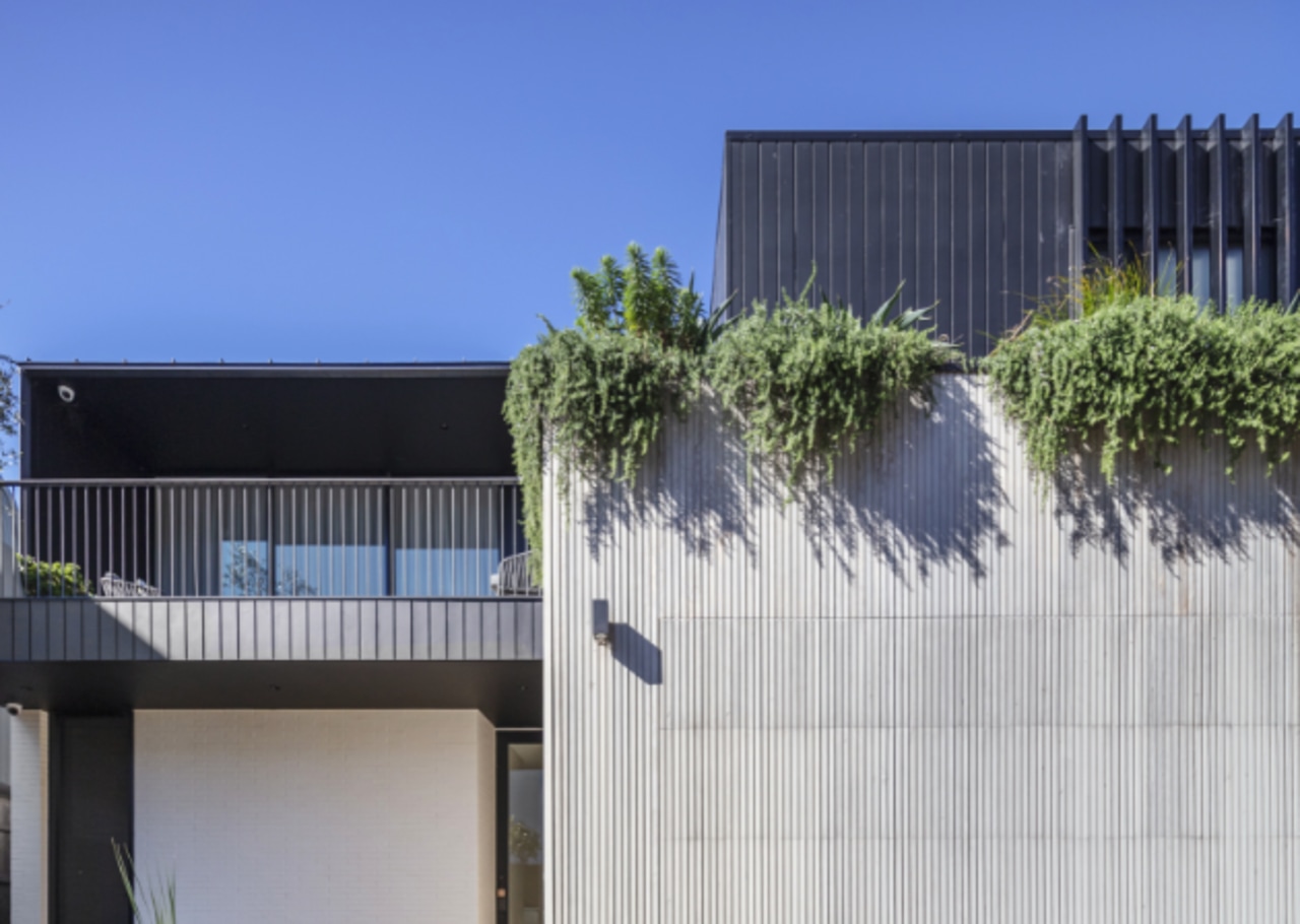 The landscaping softens the home's strong architectural lines 