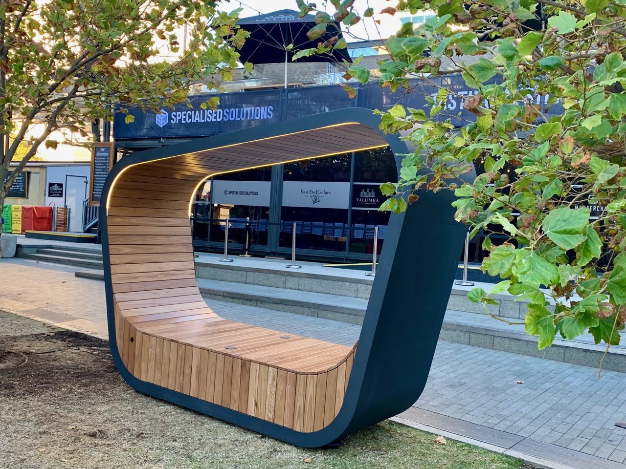 Timber lined and steel framed, the Sedi Connect architecture, bus stop, furniture, public space, swing, tram, transport, tree, vehicle, gray