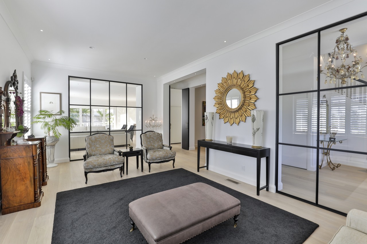 The formal living room with the custom glass 