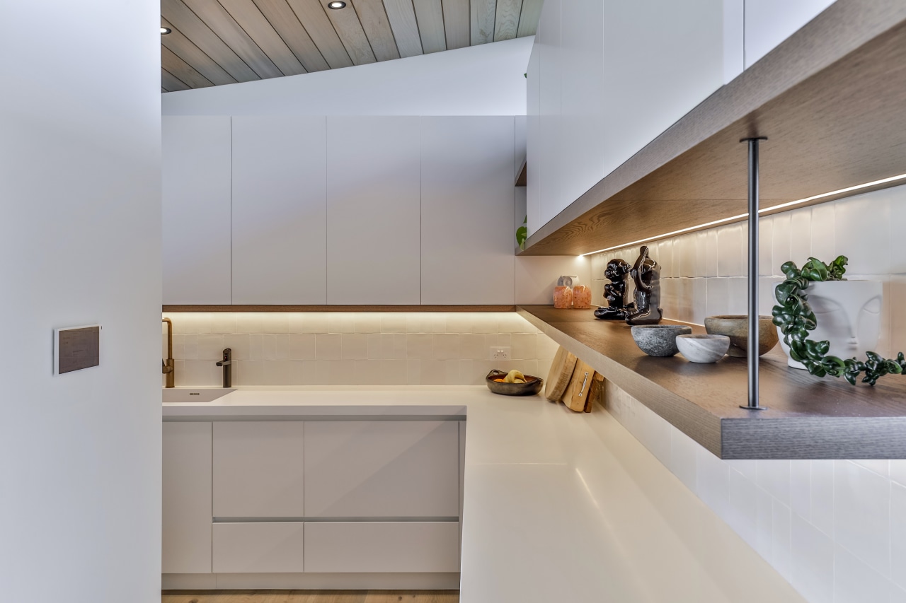 Walk-in scullery with under cabinet lighting. 