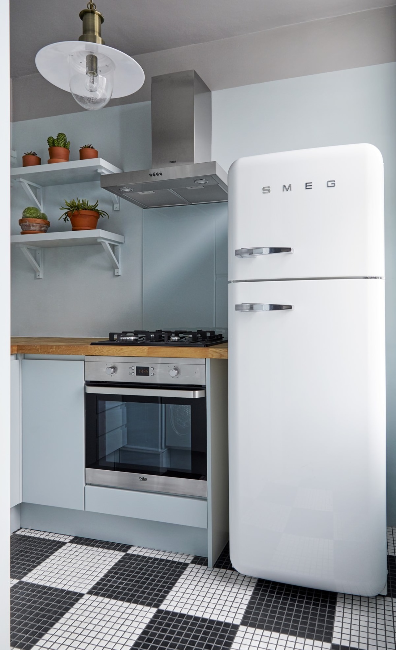 Saving space is essential in apartments – especially gas stove, home appliance, kitchen, kitchen appliance, kitchen stove, major appliance, microwave oven, product, product design, refrigerator, small appliance, gray, white