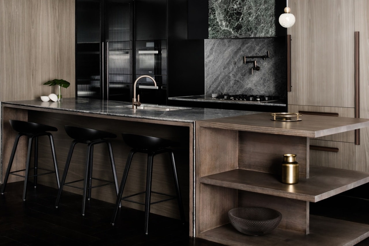 This island is perfect for an apartment, featuring cabinetry, countertop, floor, flooring, furniture, interior design, kitchen, sink, table, black, gray