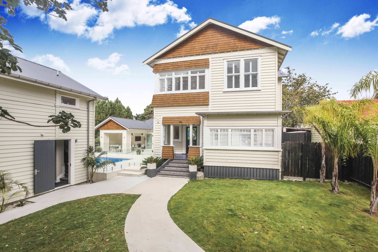 A path winds up the front steps - backyard, cottage, elevation, estate, facade, home, house, neighbourhood, property, real estate, residential area, siding, villa, yard, white, brown