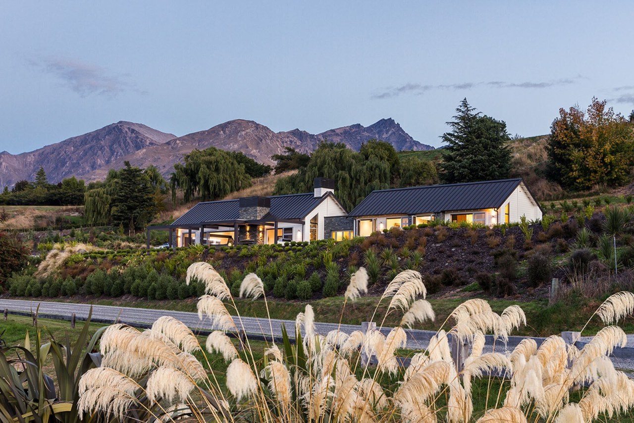 This home is stunning in so many ways. cottage, farm, flower, home, house, landscape, mountain, plant, real estate, rural area, sky, spring, tree, teal, brown