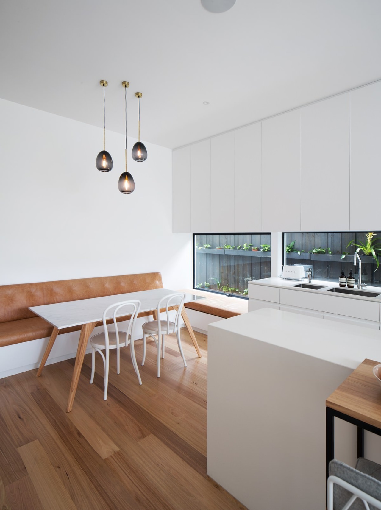 This dining area is ideal for a young floor, house, interior design, kitchen, product design, table, white, gray