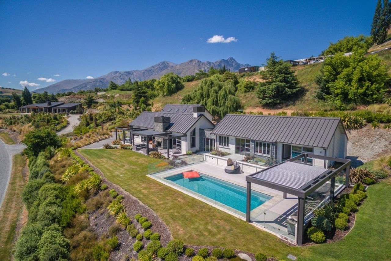 The word ‘relax’ comes to mind with this aerial photography, bird's eye view, cottage, estate, home, house, land lot, mansion, property, real estate, residential area, suburb, villa, brown