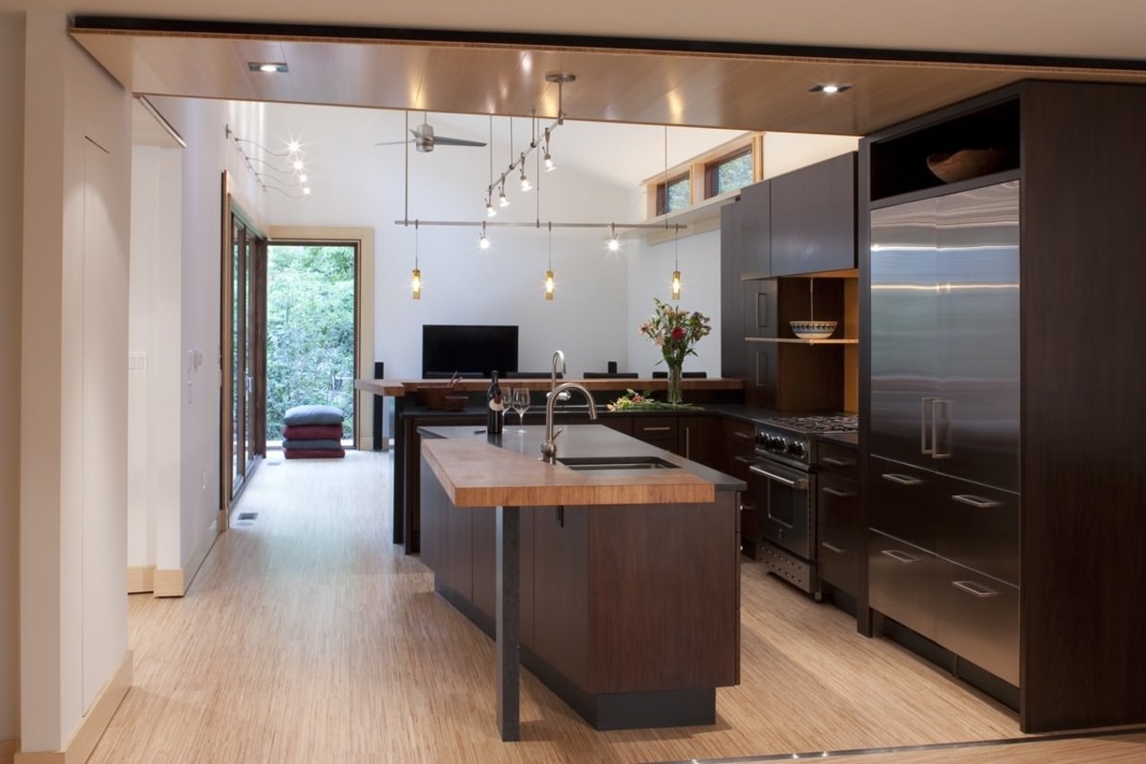 Every effort was made to make the new cabinetry, countertop, cuisine classique, floor, flooring, hardwood, interior design, kitchen, room, wood flooring, gray, black